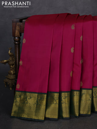 Pure kanchipuram silk saree pink and bottle green with zari woven buttas and zari woven korvai border