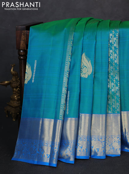 Pure kanchipuram silk saree dual shade of bluish green and cs blue with silver & zari woven buttas and long rich zari woven border