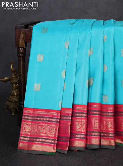 Pure kanchipuram silk saree teal blue and green with zari woven buttas and zari woven korvai border