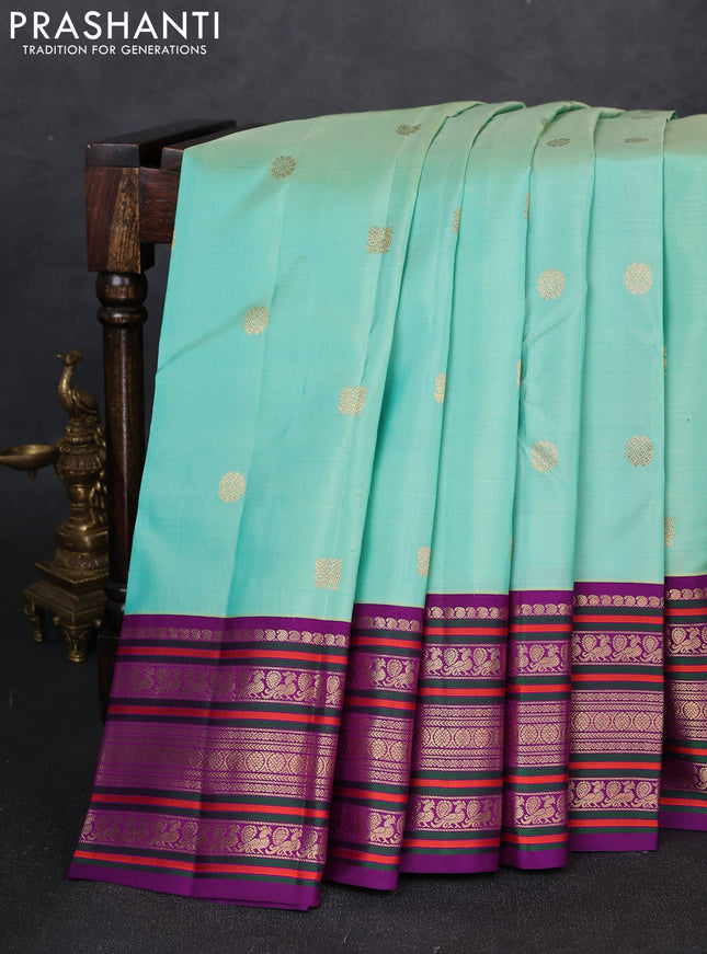 Pure kanchipuram silk saree teal green and purple with zari woven buttas and long thread & zari woven buttas