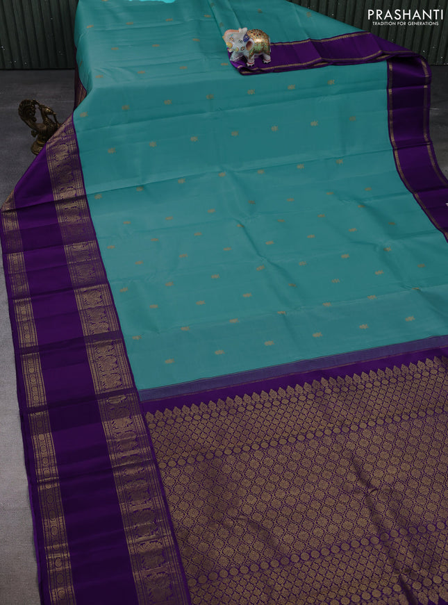 Pure kanchipuram silk saree teal blue and purple with zari woven buttas and rettapet zari woven border