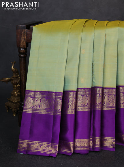 Pure kanchipuram silk saree dual shade teal green and purple with zari woven buttas and rettapet zari woven border