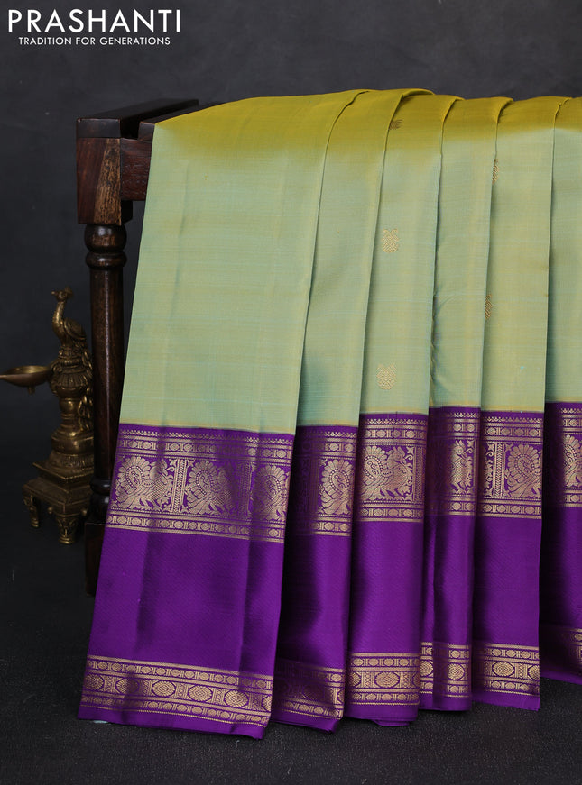 Pure kanchipuram silk saree dual shade teal green and purple with zari woven buttas and rettapet zari woven border