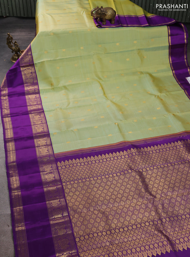 Pure kanchipuram silk saree dual shade teal green and purple with zari woven buttas and rettapet zari woven border