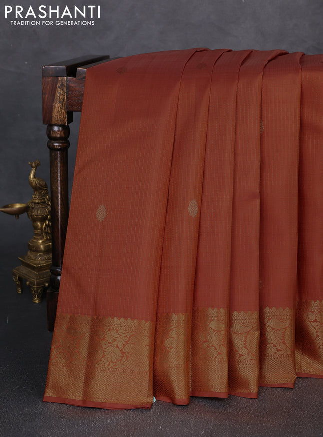 Pure kanchipuram silk saree rust shade with allover zari stripe & buttas and zari woven border