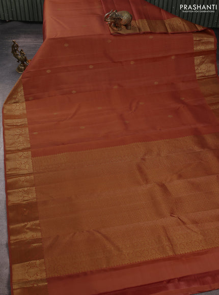 Pure kanchipuram silk saree rust shade with allover zari stripe & buttas and zari woven border