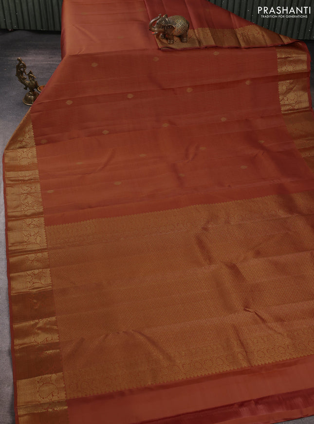 Pure kanchipuram silk saree rust shade with allover zari stripe & buttas and zari woven border
