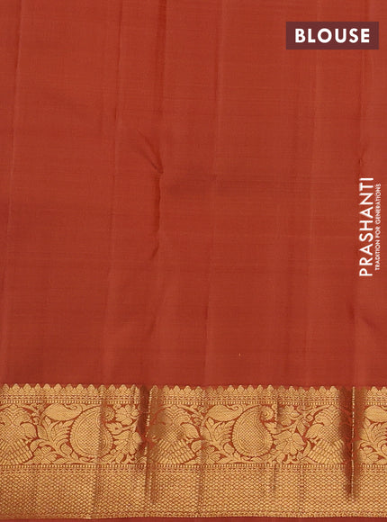 Pure kanchipuram silk saree rust shade with allover zari stripe & buttas and zari woven border