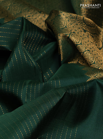 Pure kanchipuram silk saree bottle green with allover zari stripe & buttas and zari woven border