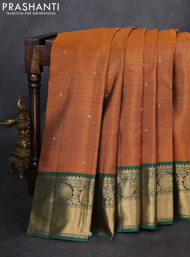 Pure kanchipuram silk saree rust shade and green with allover zari stripe & buttas and zri woven border