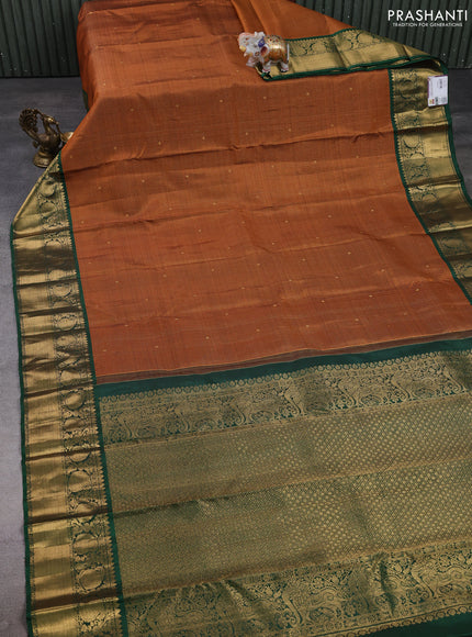 Pure kanchipuram silk saree rust shade and green with allover zari stripe & buttas and zri woven border