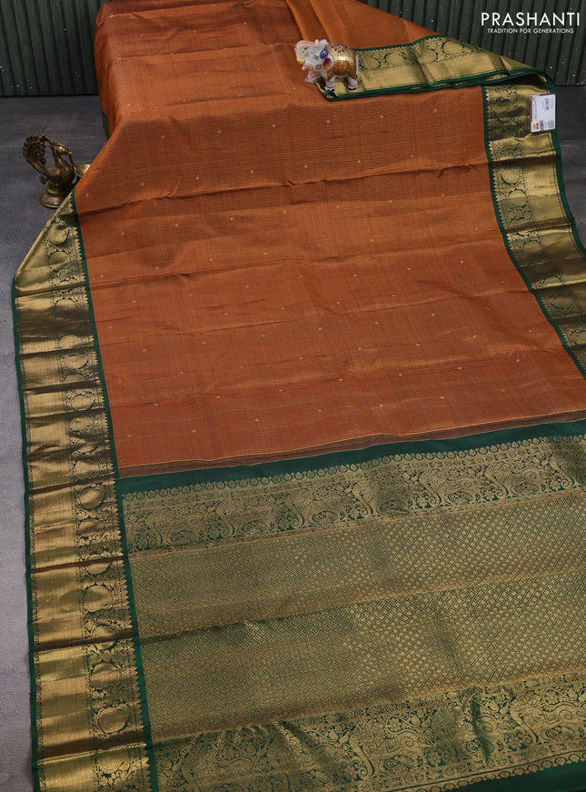 Pure kanchipuram silk saree rust shade and green with allover zari stripe & buttas and zri woven border