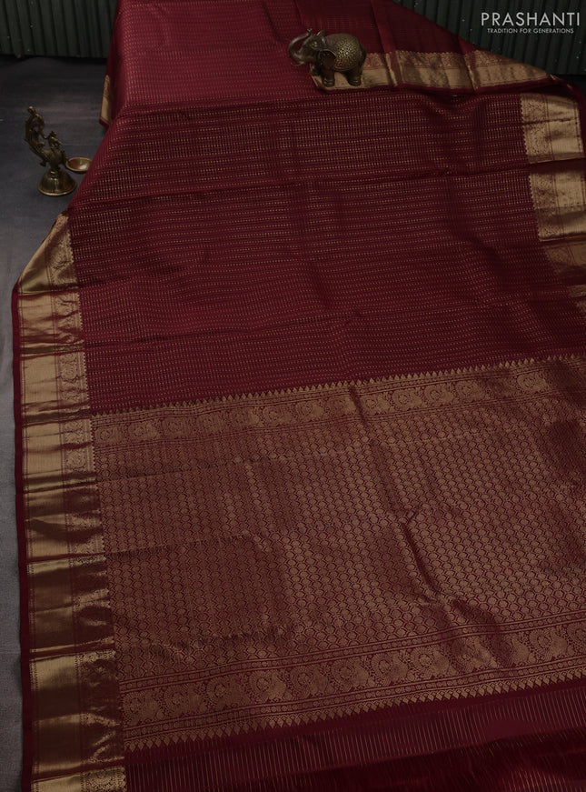 Pure kanchipuram silk saree deep wine with allover small zari checks & buttas and zari woven border
