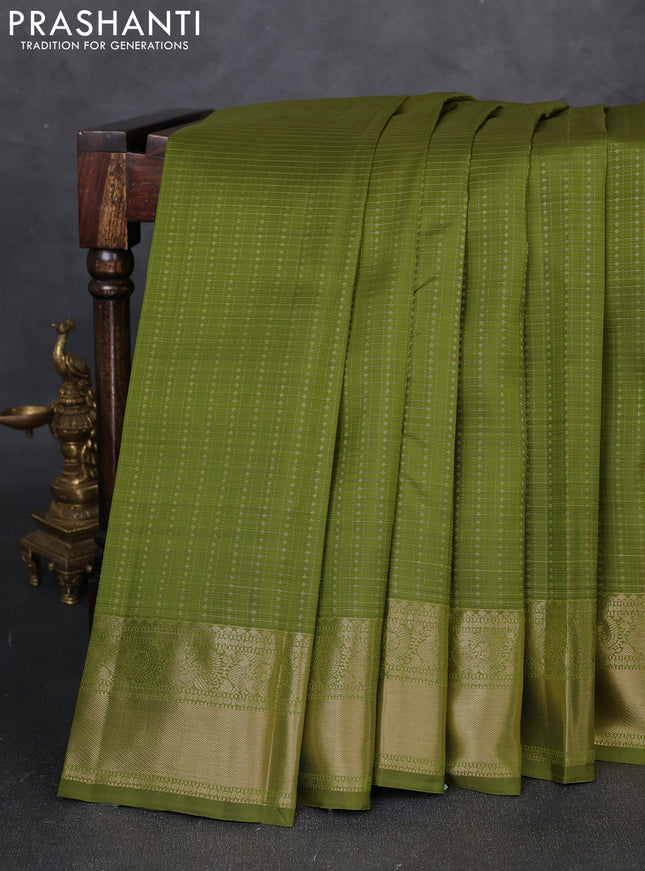 Pure kanchipuram silk saree light green with allover small zari checks & buttas and zari woven border