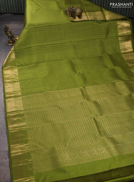 Pure kanchipuram silk saree light green with allover small zari checks & buttas and zari woven border