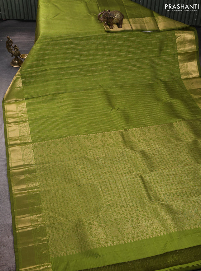Pure kanchipuram silk saree light green with allover small zari checks & buttas and zari woven border