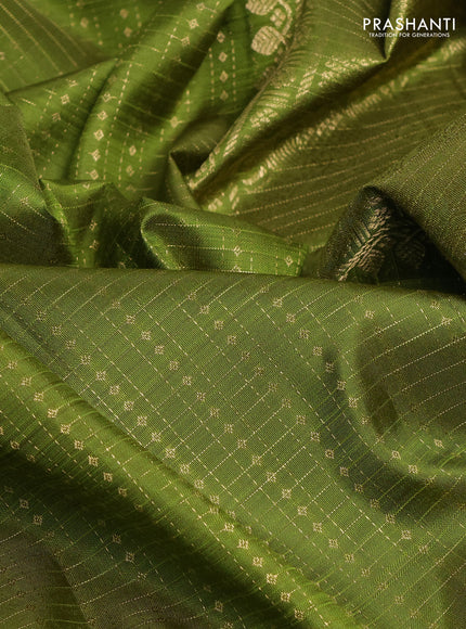 Pure kanchipuram silk saree light green with allover small zari checks & buttas and zari woven border