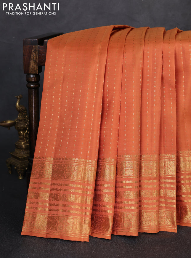 Pure kanchipuram silk saree dark mustard with allover zari woven 1000 buttas and long zari woven border