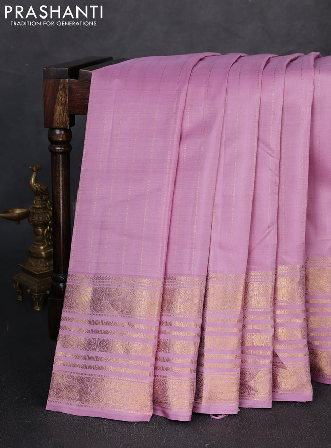 Pure kanchipuram silk saree pastel purple with allover zari stripe pattern and zari woven border