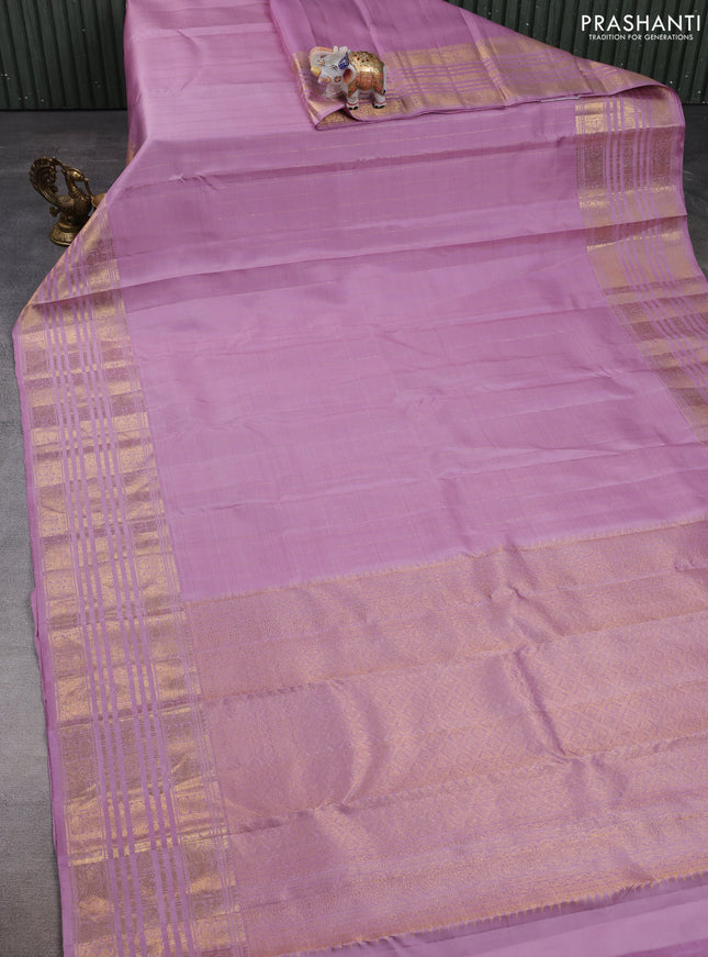 Pure kanchipuram silk saree pastel purple with allover zari stripe pattern and zari woven border