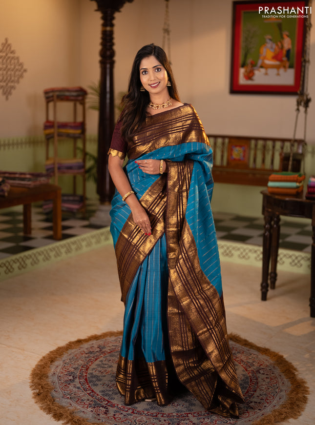 Pure kanchipuram silk saree blue and coffee brown with allover zari stripe pattern and long zari woven border