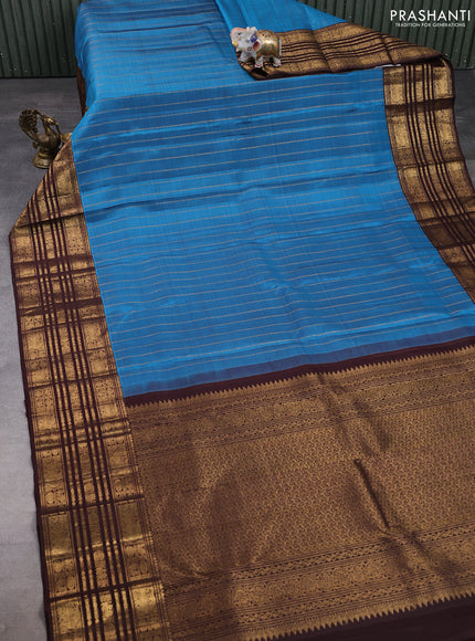 Pure kanchipuram silk saree blue and coffee brown with allover zari stripe pattern and long zari woven border