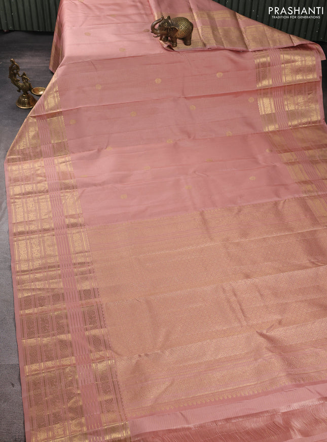 Pure kanchipuram silk saree peach shade with allover zari checks & buttas and long zari woven border