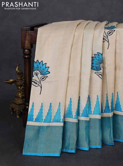Pure tussar silk saree beige and cs blue with floral butta prints and temple design zari woven border