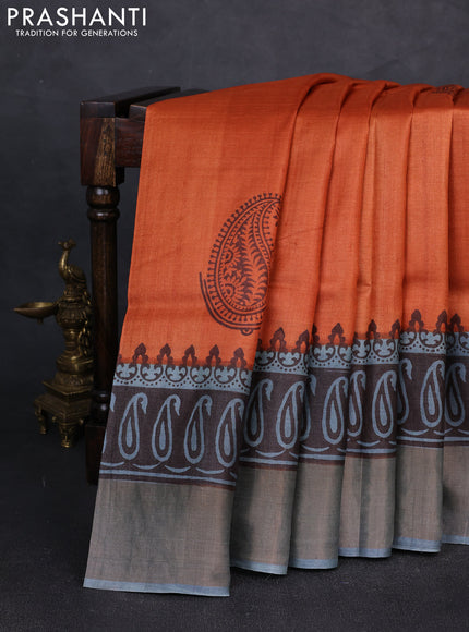 Pure tussar silk saree rustic orange and grey with paisley butta prints and long printed zari woven border