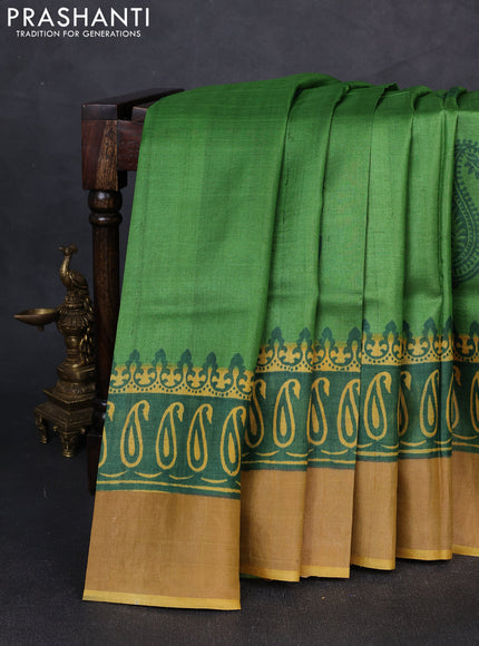 Pure tussar silk saree light green and mustard yellow with paisley butta prints and long printed zari woven border