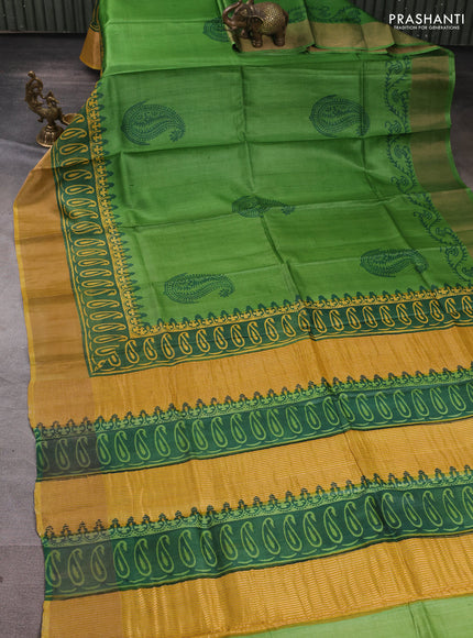 Pure tussar silk saree light green and mustard yellow with paisley butta prints and long printed zari woven border