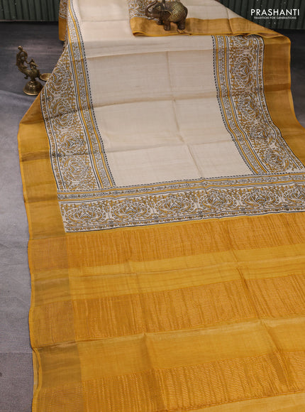 Pure tussar silk saree beige and mustard yellow with plain body and long printed zari woven border