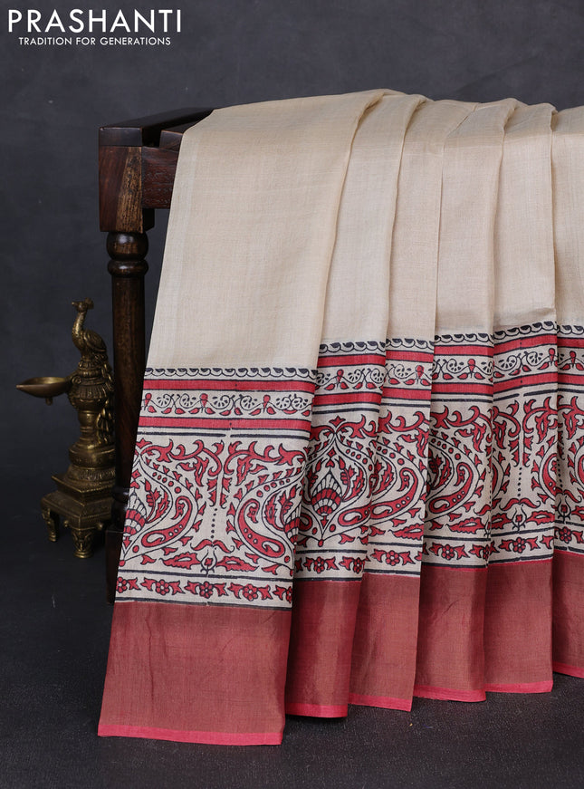 Pure tussar silk saree beige and tomato pink shade with plain body and long printed zari woven border