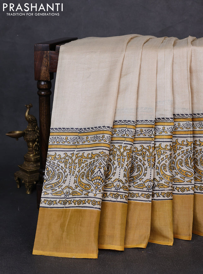 Pure tussar silk saree beige and mustard yellow with plain body and long printed zari woven border