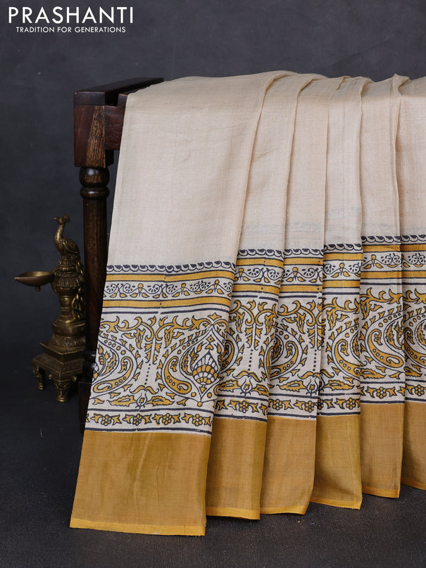 Pure tussar silk saree beige and mustard yellow with plain body and long printed zari woven border