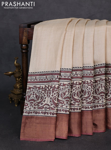 Pure tussar silk saree beige and brown with plain body and long printed zari woven border