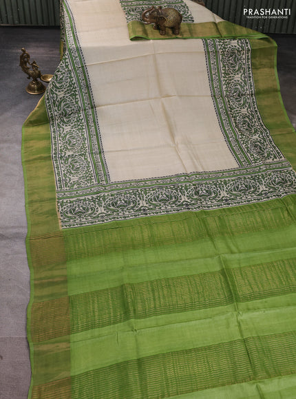 Pure tussar silk saree beige and green with plain body and long printed zari woven border