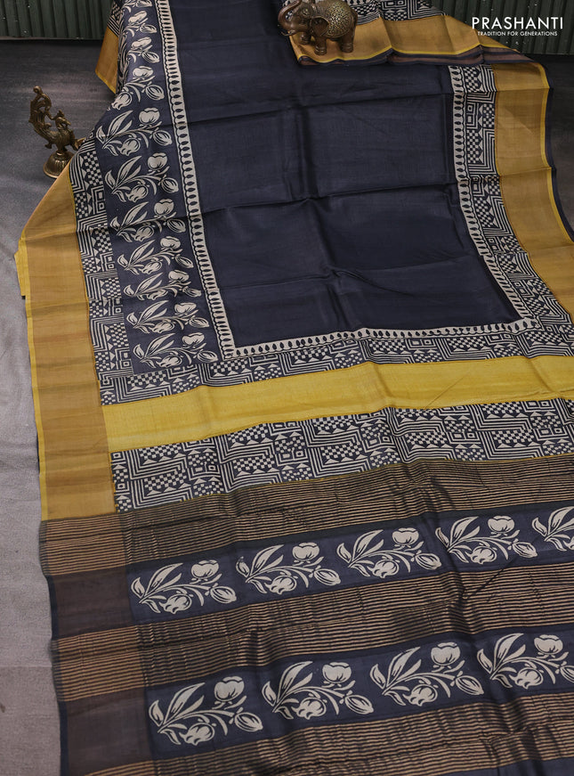 Pure tussar silk saree black and mustard yellow with plain body and long printed zari woven border