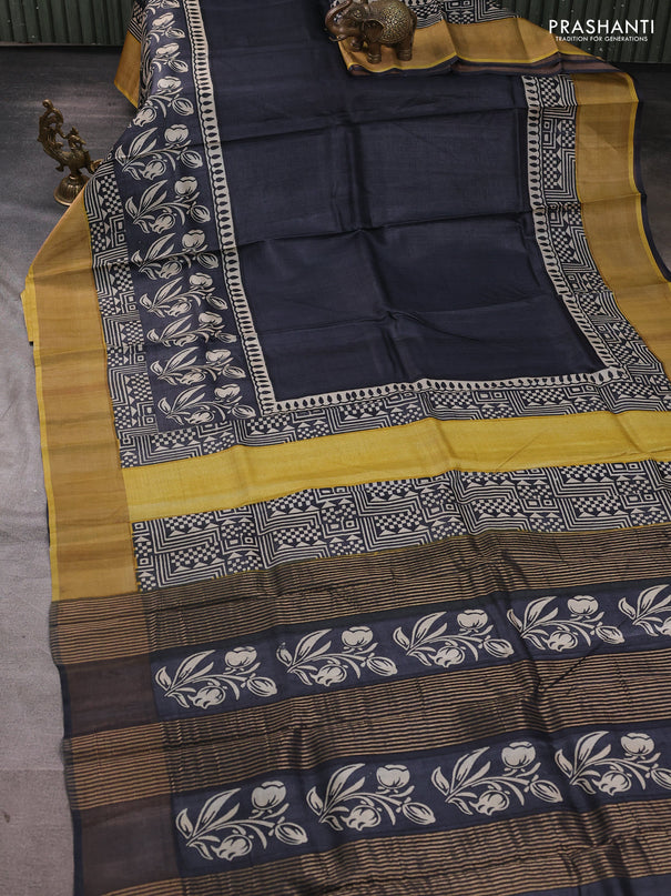 Pure tussar silk saree black and mustard yellow with plain body and long printed zari woven border