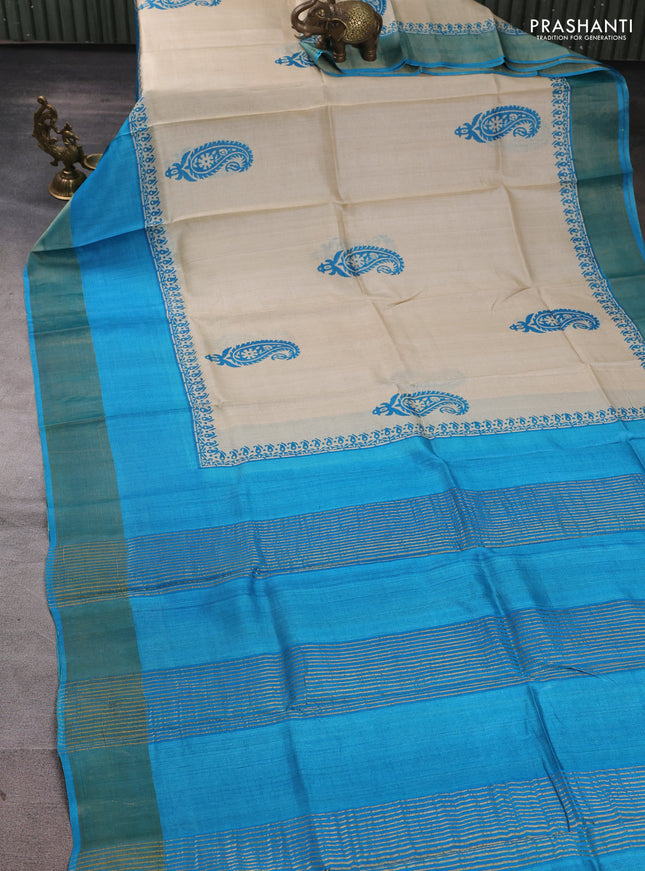 Pure tussar silk saree beige and cs blue with paisley butta prints and long simple zari woven border