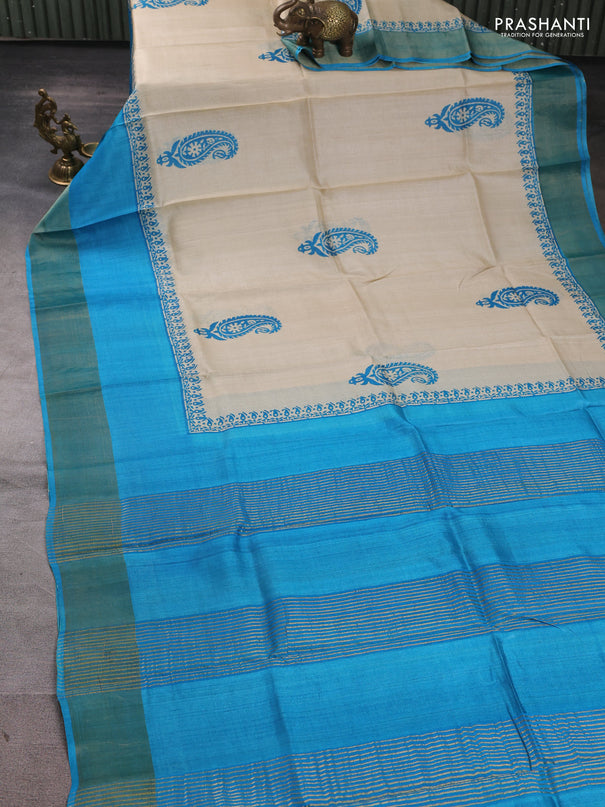 Pure tussar silk saree beige and cs blue with paisley butta prints and long simple zari woven border