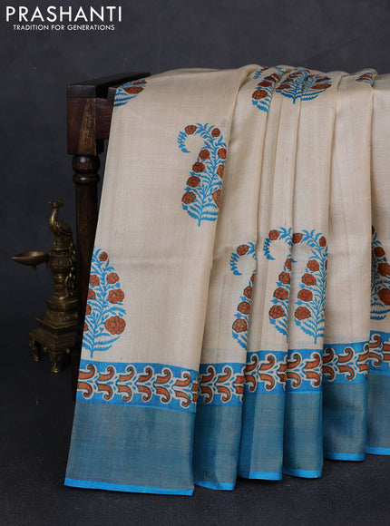 Pure tussar silk saree beige and cs blue with paisley butta prints and zari woven border