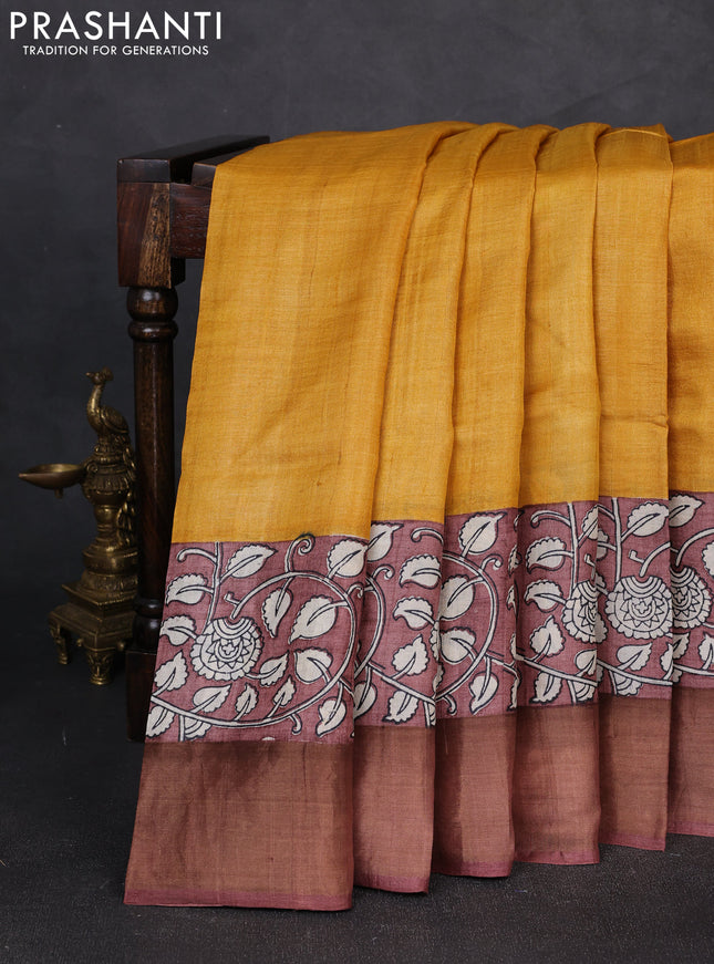 Pure tussar silk saree mustard yellow and pastel brown with plain body and long printed zari woven border