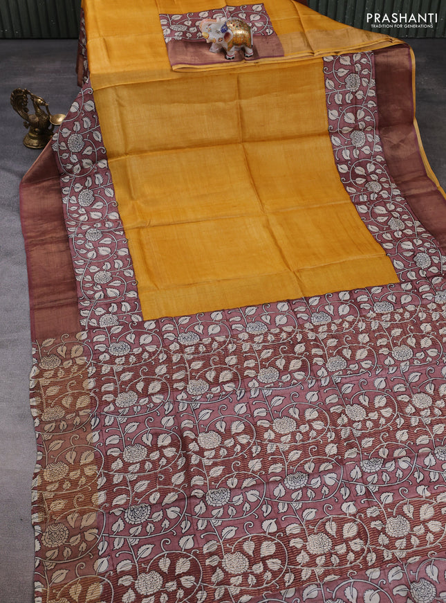 Pure tussar silk saree mustard yellow and pastel brown with plain body and long printed zari woven border