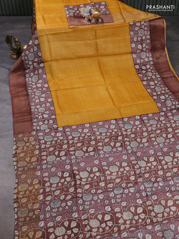 Pure tussar silk saree mustard yellow and pastel brown with plain body and long printed zari woven border