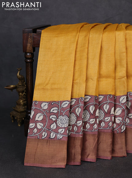 Pure tussar silk saree mustard yellow and pastel brown with plain body and long printed zari woven border