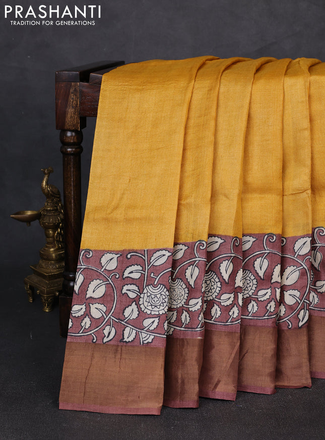 Pure tussar silk saree mustard yellow and pastel brown with plain body and long printed zari woven border