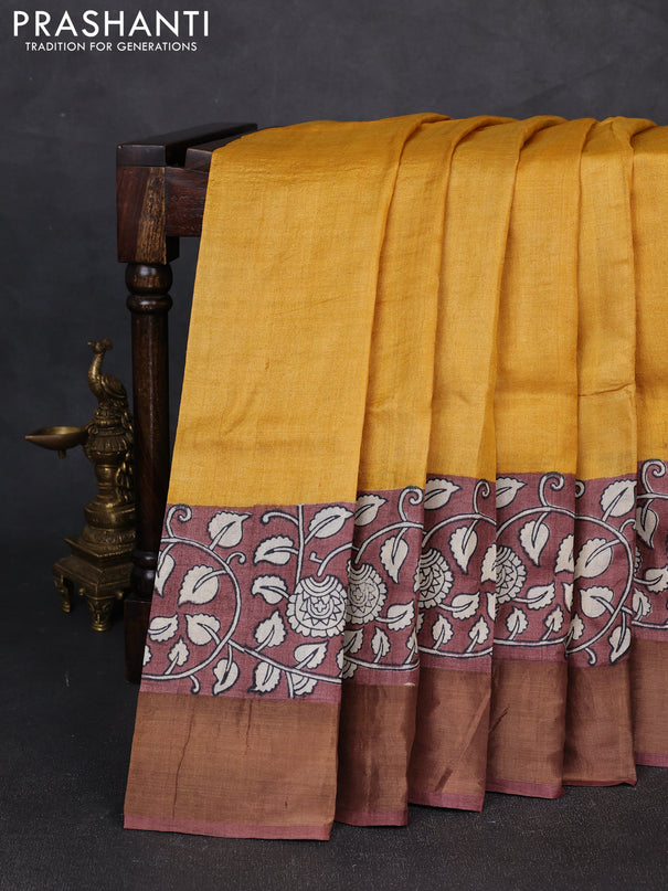Pure tussar silk saree mustard yellow and pastel brown with plain body and long printed zari woven border