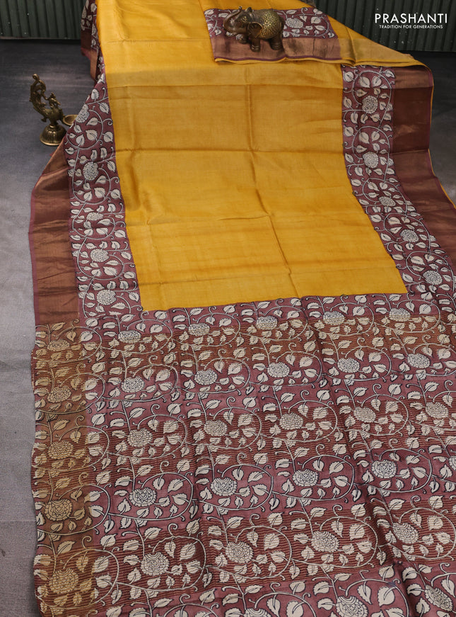 Pure tussar silk saree mustard yellow and pastel brown with plain body and long printed zari woven border