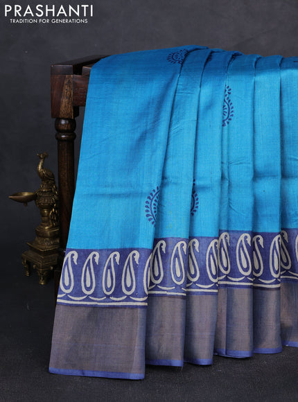 Pure tussar silk saree cs blue and grey with plain body and long printed zari woven border